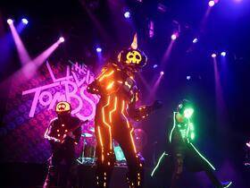 The Living Tombstone with Mystery Skulls